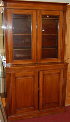 Lot 1166 - An Edwardian walnut bookcase cupboard, having...