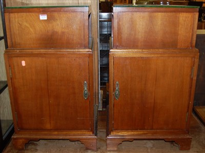 Lot 1170 - A pair of mahogany single door bedside...