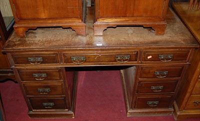 Lot 1171 - An Edwardian walnut twin pedestal writing desk,...