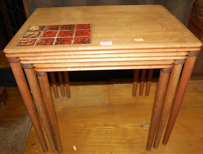 Lot 1172 - A 1960s teak nest of three occasional tables,...