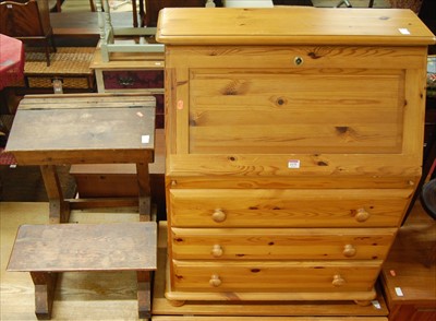 Lot 1175 - A modern pine slopefront three drawer writing...