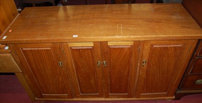 Lot 1178 - A contemporary hardwood four-door sideboard, w....