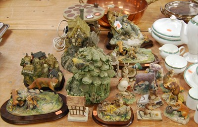 Lot 103 - A collection of various modern resin figures...