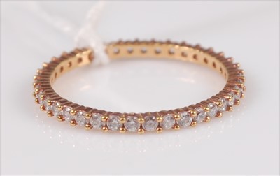 Lot 308 - A Swarovski gilt metal and paste set eternity...