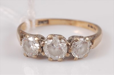 Lot 314 - A 9ct gold cz set three stone ring, gross...