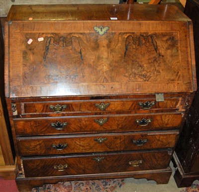 Lot 1202 - A mid-18th century figured walnut cross-and...