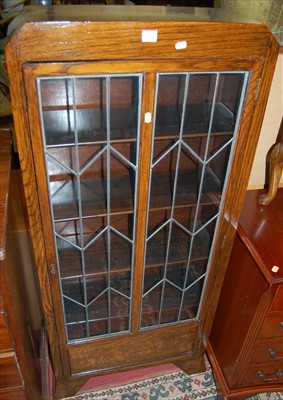 Lot 1205 - An Art Deco oak and lead glazed single door...