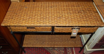 Lot 1208 - A contemporary tubular iron framed and wicker...