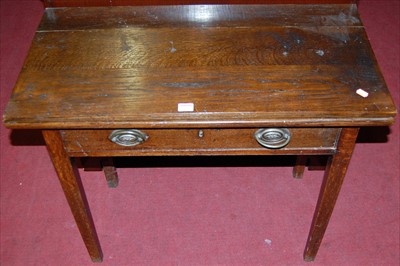 Lot 1217 - A 19th century provincial elm fold-over tea...