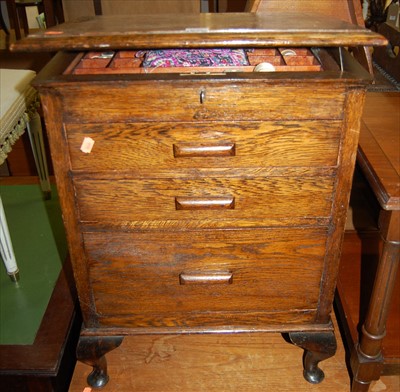 Lot 1222 - A 1930s oak hinge topped three drawer sewing...