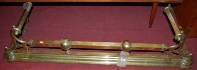 Lot 1226 - An Art Nouveau brass fire fender, having...