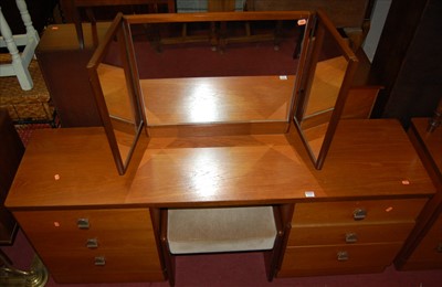 Lot 1229 - A G-Plan teak round cornered long kneehole...