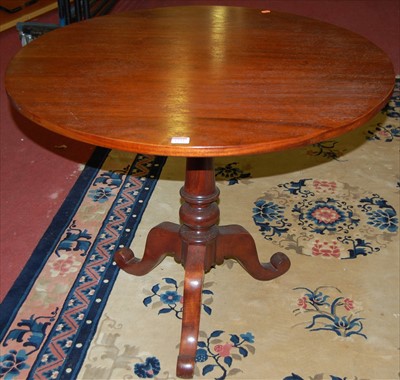 Lot 1239 - A 19th century mahogany circular tilt-top...
