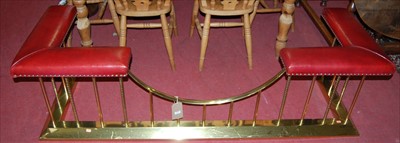 Lot 1251 - A contemporary brass and ox blood red leather...