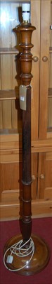 Lot 1253 - An early 20th century turned and reeded walnut...