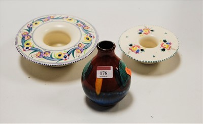 Lot 176 - A Poole Pottery bud vase, having raised Poole...