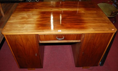 Lot 1264 - An Art Deco walnut round cornered kneehole...