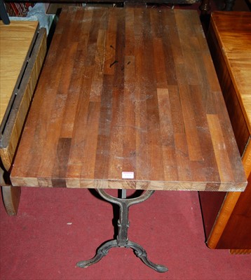 Lot 1266 - A hardwood topped and cast iron based...