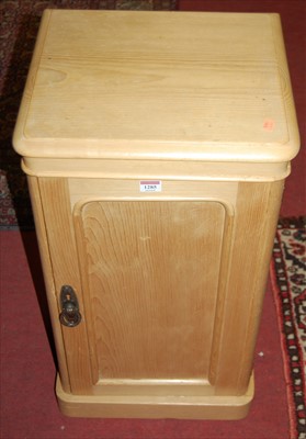 Lot 1285 - A pine round cornered single door bedside...