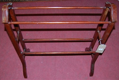 Lot 1287 - An Edwardian stained walnut towel-rail, w.71.5cm