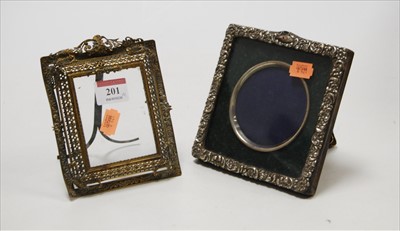 Lot 201 - An Edwardian silver clad easel photograph...