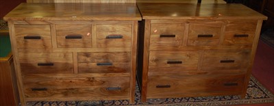 Lot 1288 - A pair of contemporary teak side chests, each...
