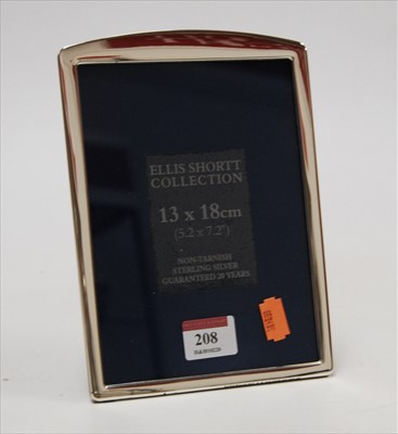 Lot 208 - A modern silver clad easel photograph frame,...