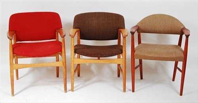 Lot 1311 - Two 1960s Danish oak framed elbow chairs, each...