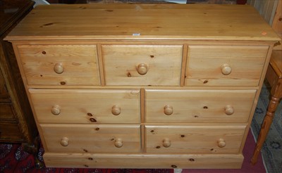 Lot 1326 - A modern pine side chest fitted with three...