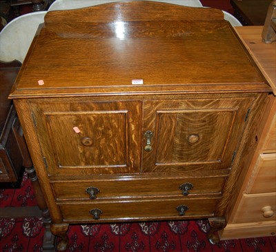 Lot 1327 - A 1930s oak ledgeback double door side...