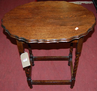 Lot 1336 - A 1930s barley twist oak piecrust topped...
