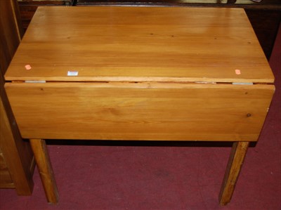 Lot 1337 - A modern stained pine drop flap kitchen table