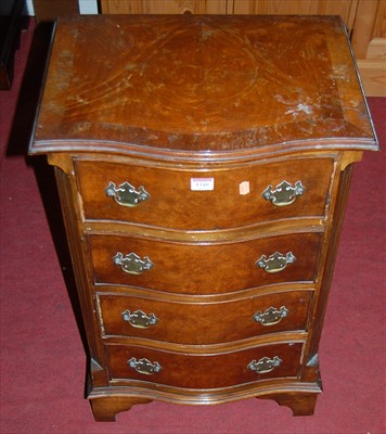 Lot 1340 - A figured walnut serpentine front four drawer...