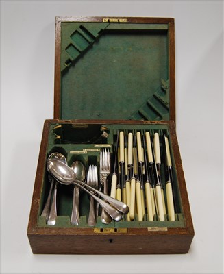 Lot 230 - A 1920s oak cased canteen of silver plated...