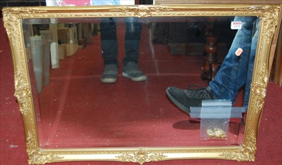 Lot 1074 - A gilt framed and bevelled rectangular wall...