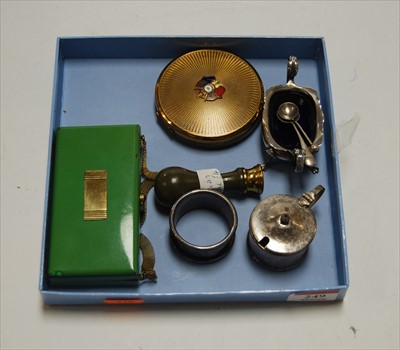 Lot 249 - An Art Deco green enamelled and brass ladies...