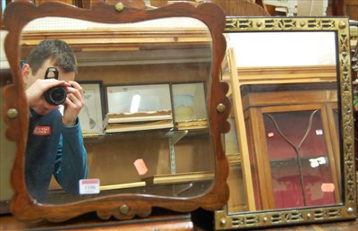 Lot 1106 - A rosewood framed and shaped wall mirror...