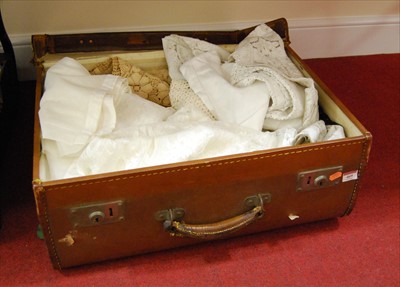 Lot 469 - A leather suitcase containing a quantity of...