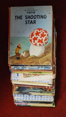Lot 434 - A box containing a quantity of Tintin cartoon...