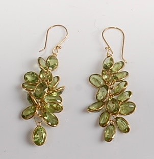 Lot 2161 - A pair of yellow metal peridot multi-stone...