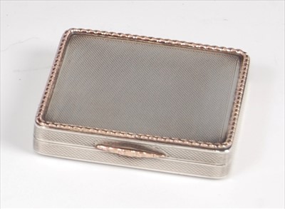 Lot 154 - An Art Deco silver and gold trim pocket...