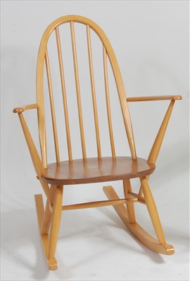 Lot 401 - A 1960s Ercol blond elm stickback rocking...