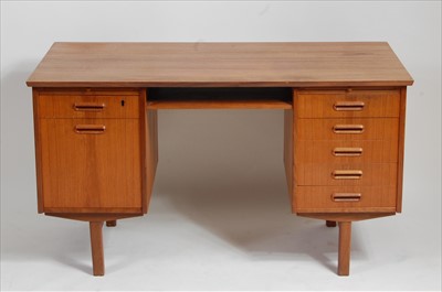 Lot 371 - A 1960s Danish teak kneehole writing desk,...