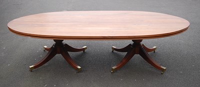 Lot 1214 - A Canadian walnut twin pedestal dining table,...
