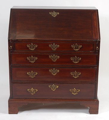 Lot 1380 - A George III mahogany slopefront writing...