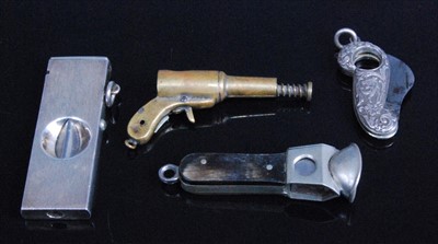 Lot 321 - A circa 1900 white metal pocket cigar cutter...