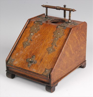 Lot 339 - A late Victorian oak and brass mounted smokers...