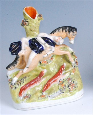 Lot 1109 - A Victorian Staffordshire flatback spill vase...