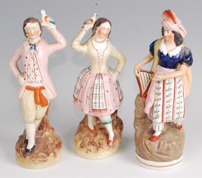 Lot 211 - A pair of 19th century Staffordshire pearlware...