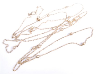 Lot 1217 - A yellow metal guard chain, featuring an oval...